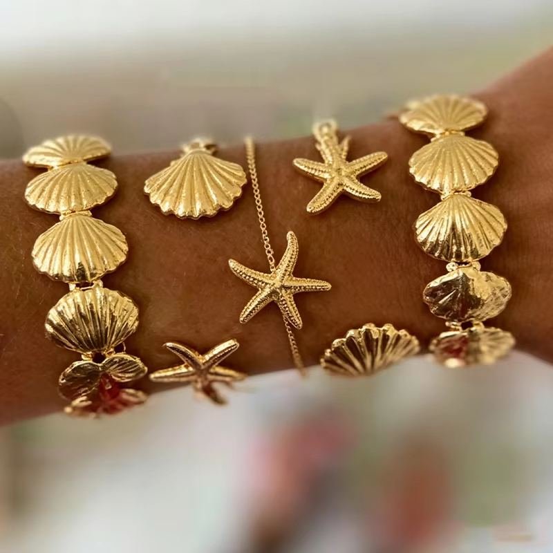 Gold bracelets worn on wrist