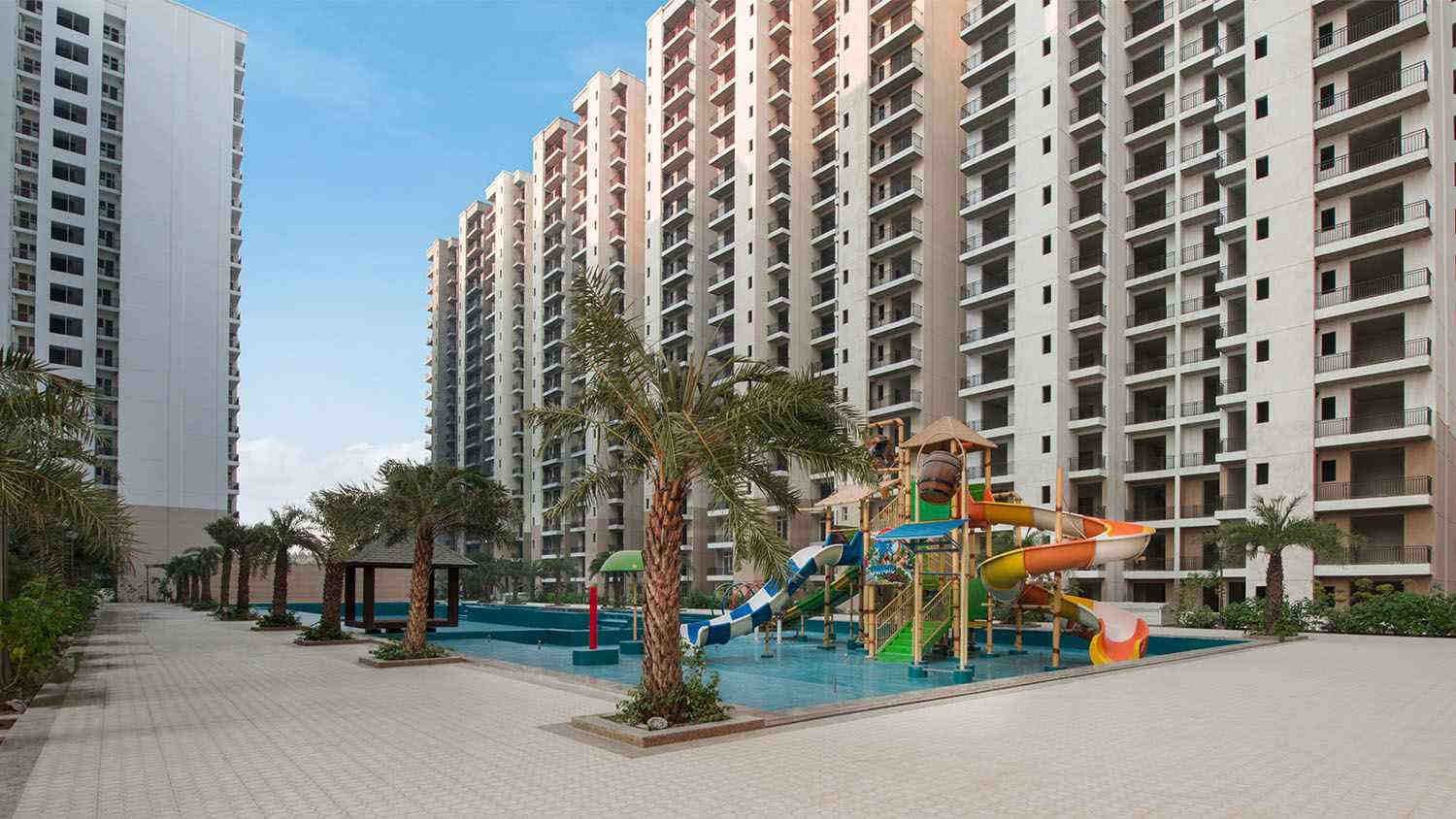Luxury apartment complex with swimming pool and play area in Lucknow, listed by Agarwal Property Dealers, property dealer in Hussain Ganj
