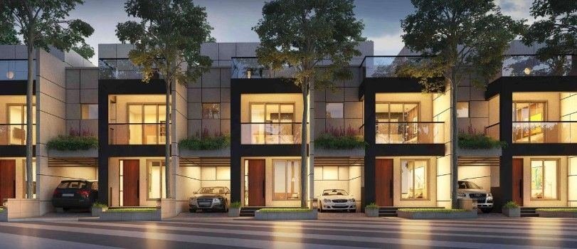 Row of modern luxury villas at dusk for sale in Lucknow by Agarwal Property Dealers