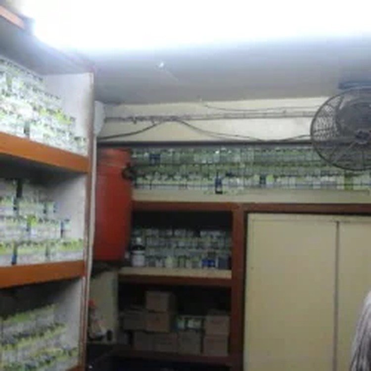 Organised medicine storage racks inside Anand Homeo Care