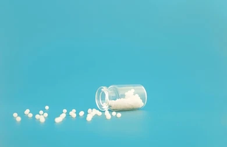 Homeopathic globules and bottle close-up