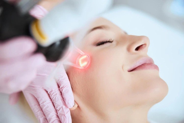 Close-up of a laser facial therapy session
