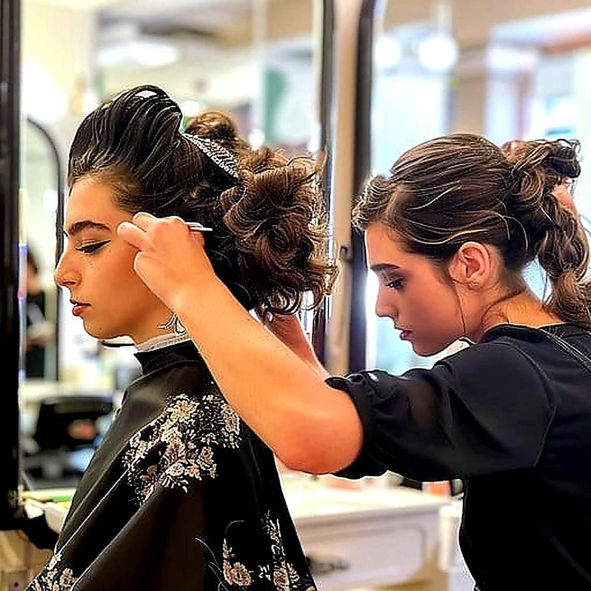 Elegant bridal updo styling at Apple Beauty Salon