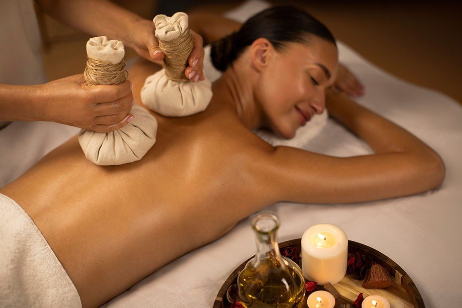 Panchakarma potli herbal massage therapy in progress