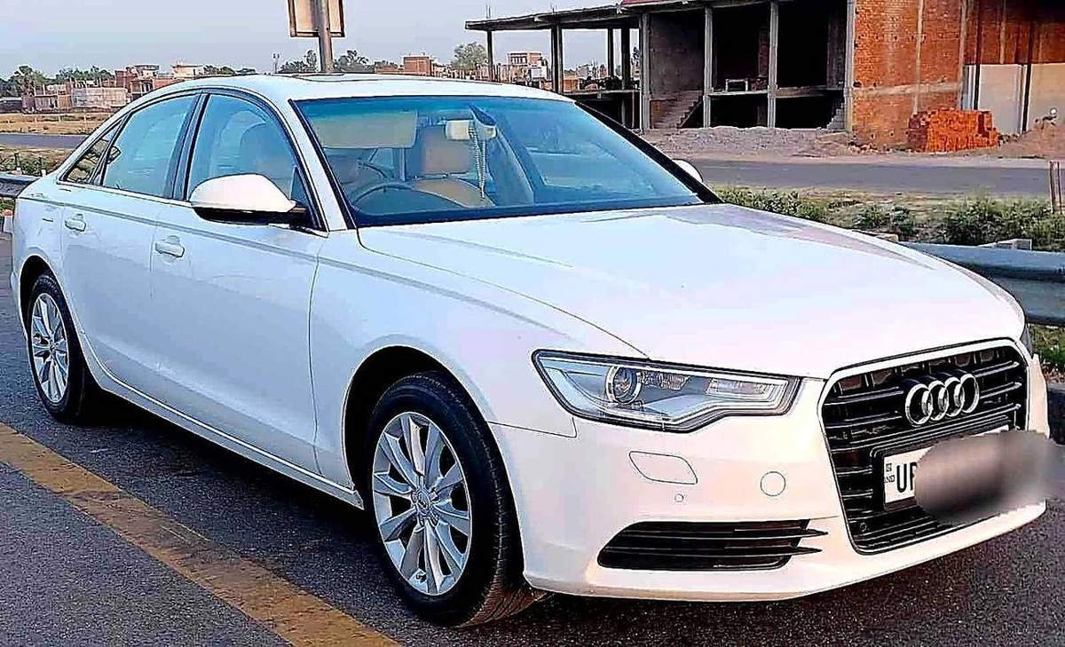 White Audi luxury rental car from Awadh Travels fleet, premium car hire Lucknow