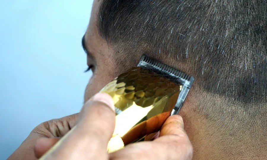 Clipper fade haircut close-up by Lucknow barber