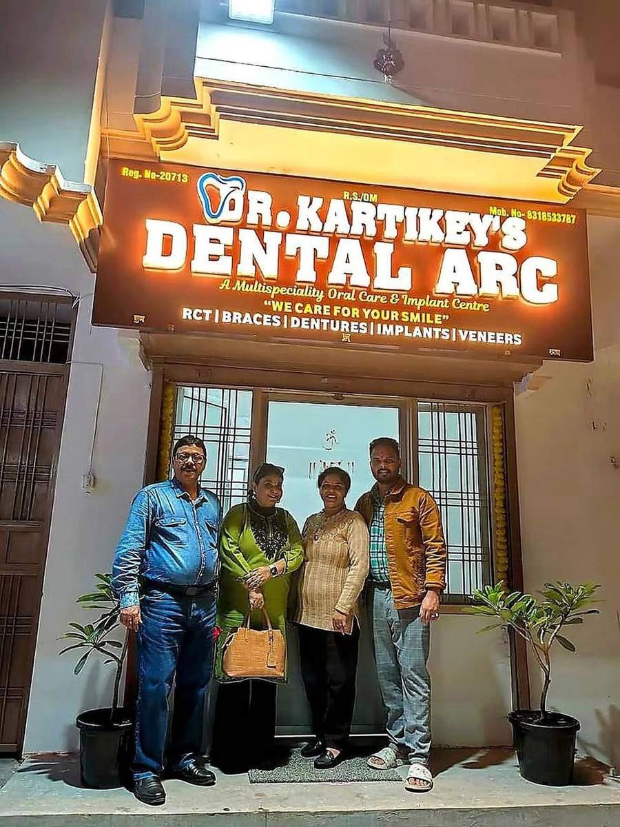 Dental Arc clinic front at night with patients waiting