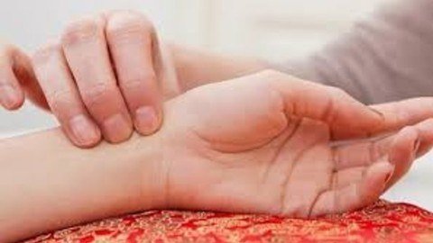 Close-up of ayurvedic pulse reading on a patient's wrist