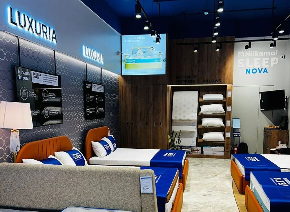 Mattress showroom with branded display beds at Harsh Foam Agencies, mattress store in Aminabad Lucknow