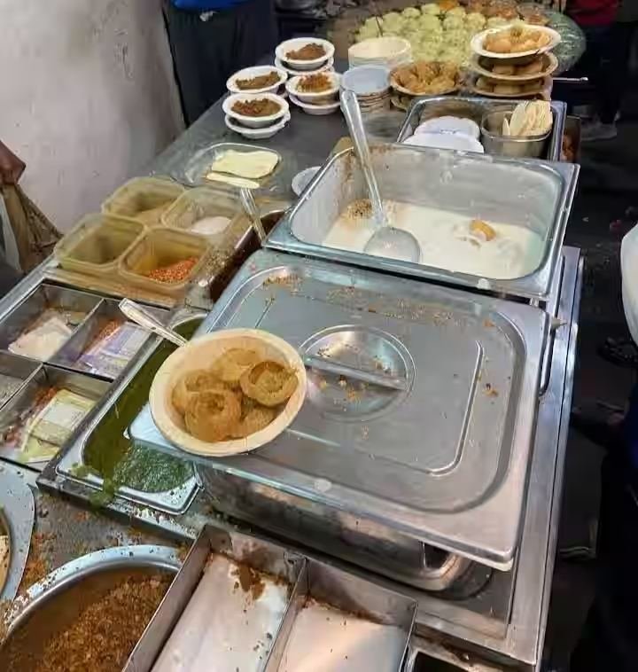 Chaat counter with dahi vada, papdi and chutneys