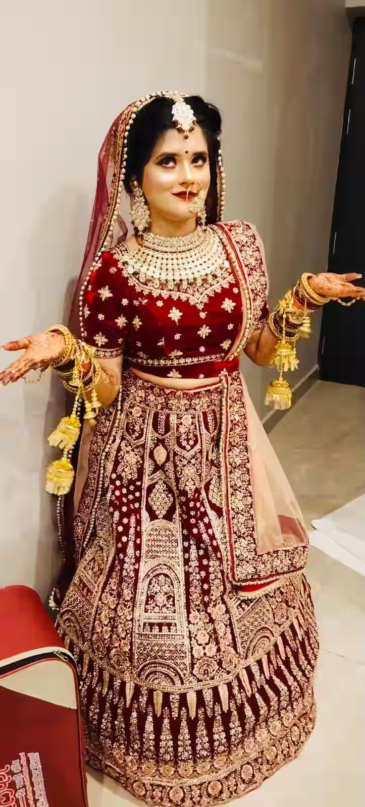 Bridal makeover in red lehenga by Jannat Makeover Studio Lucknow