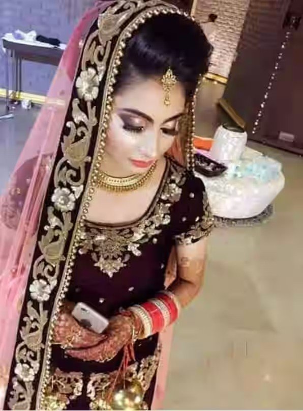 Bridal makeup look in dark lehenga at Jannat studio Lucknow