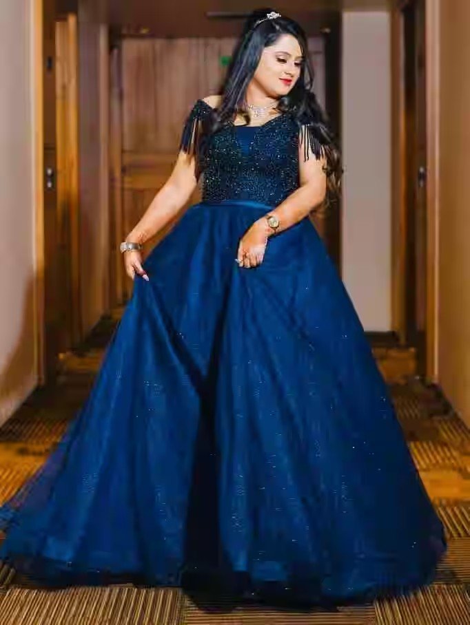 Engagement reception look in blue gown by Jannat Makeover