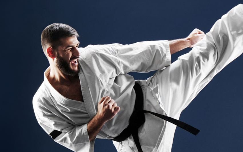 Karate black belt flying kick
