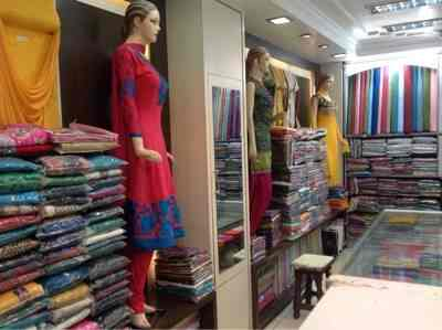 Boutique interior with dress material shelves