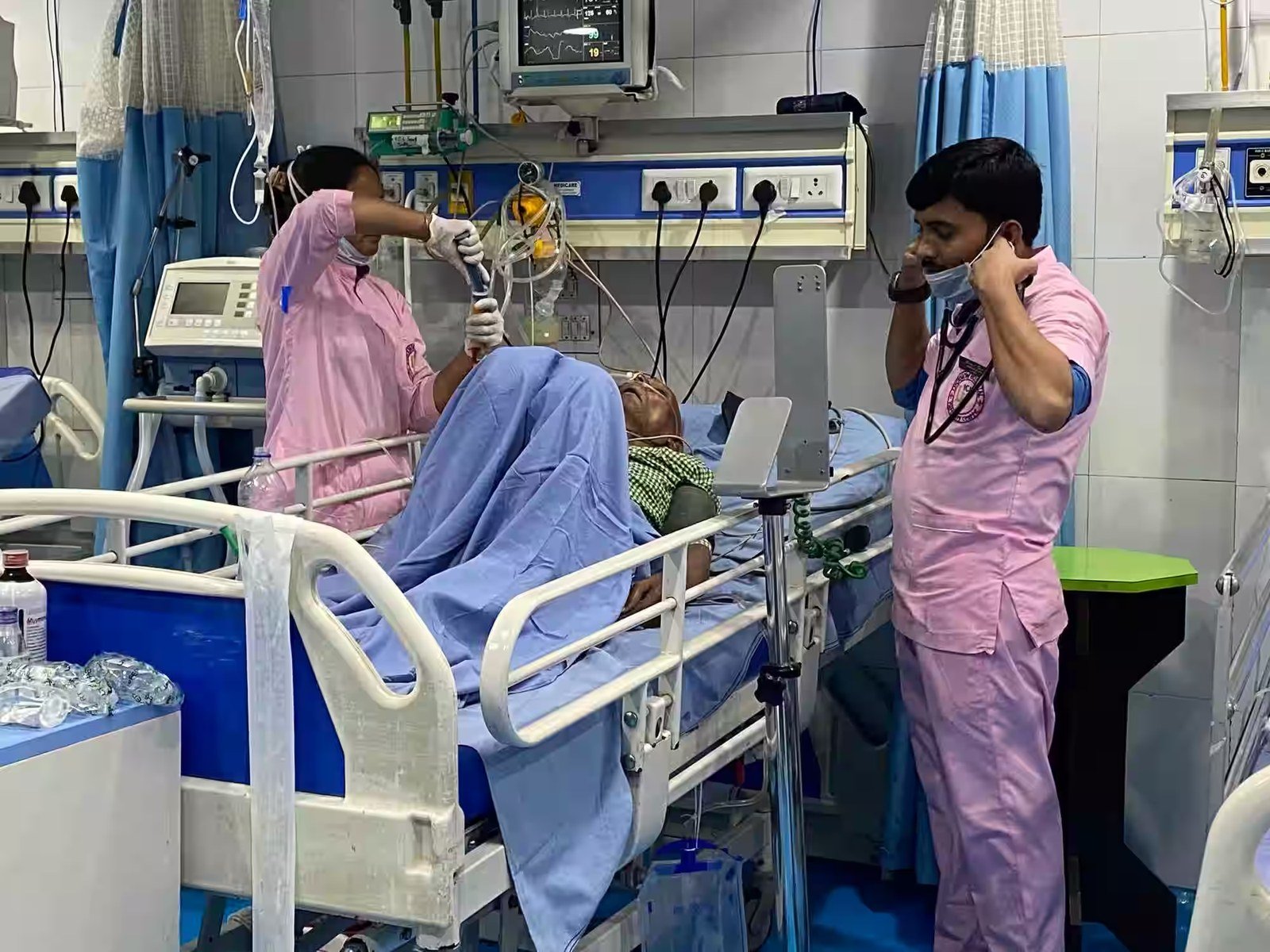 Nursing staff attending a patient in the ICU ward at Lucknow Hospital and Maternity Centre, Daliganj