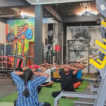 Group stretching session at Muscle Studio Arena gym