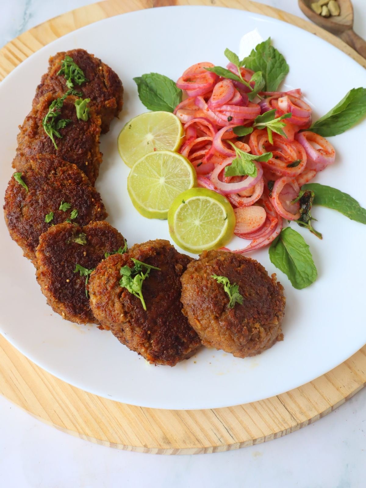 Galouti kebab plate with onions — Mughlai food in Chowk Lucknow