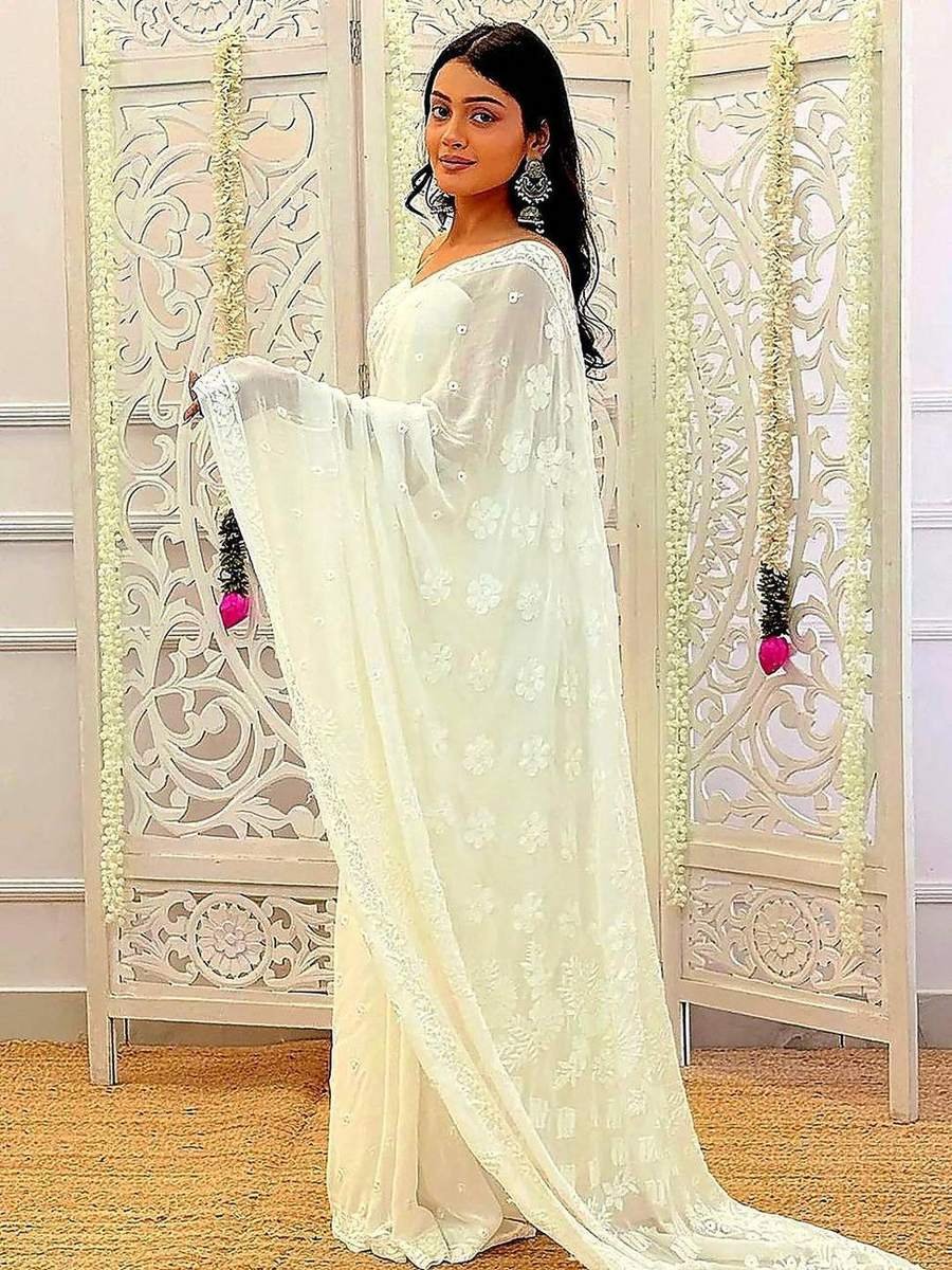 Elegant white chikankari saree with graceful drape