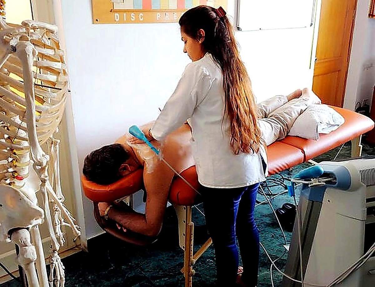 Ultrasound therapy being applied on a patient's back