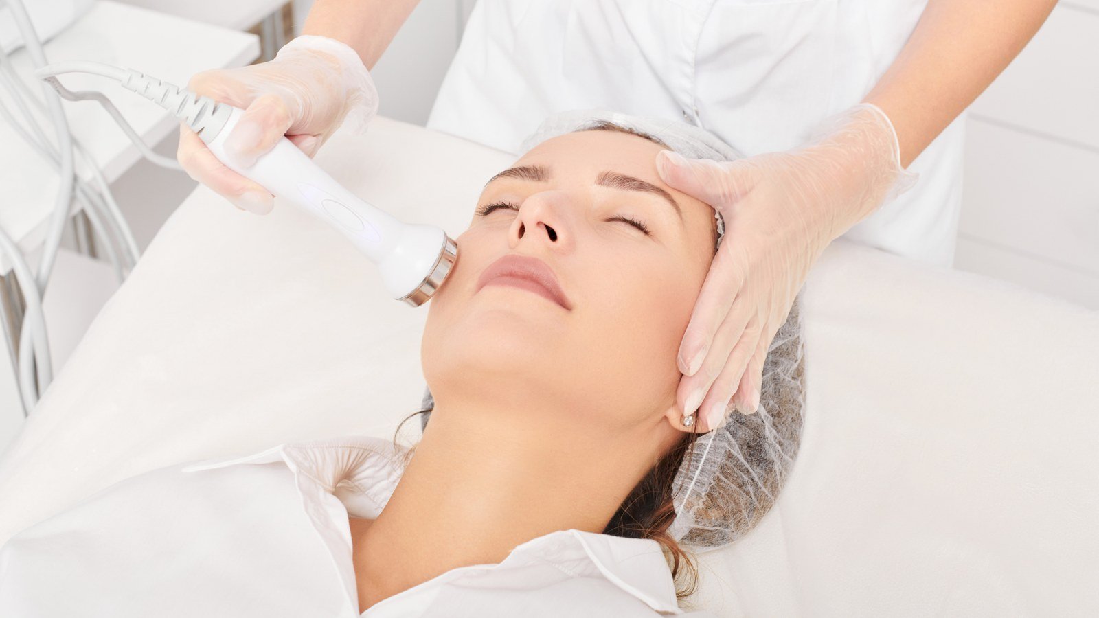 RF skin tightening treatment on a client's face