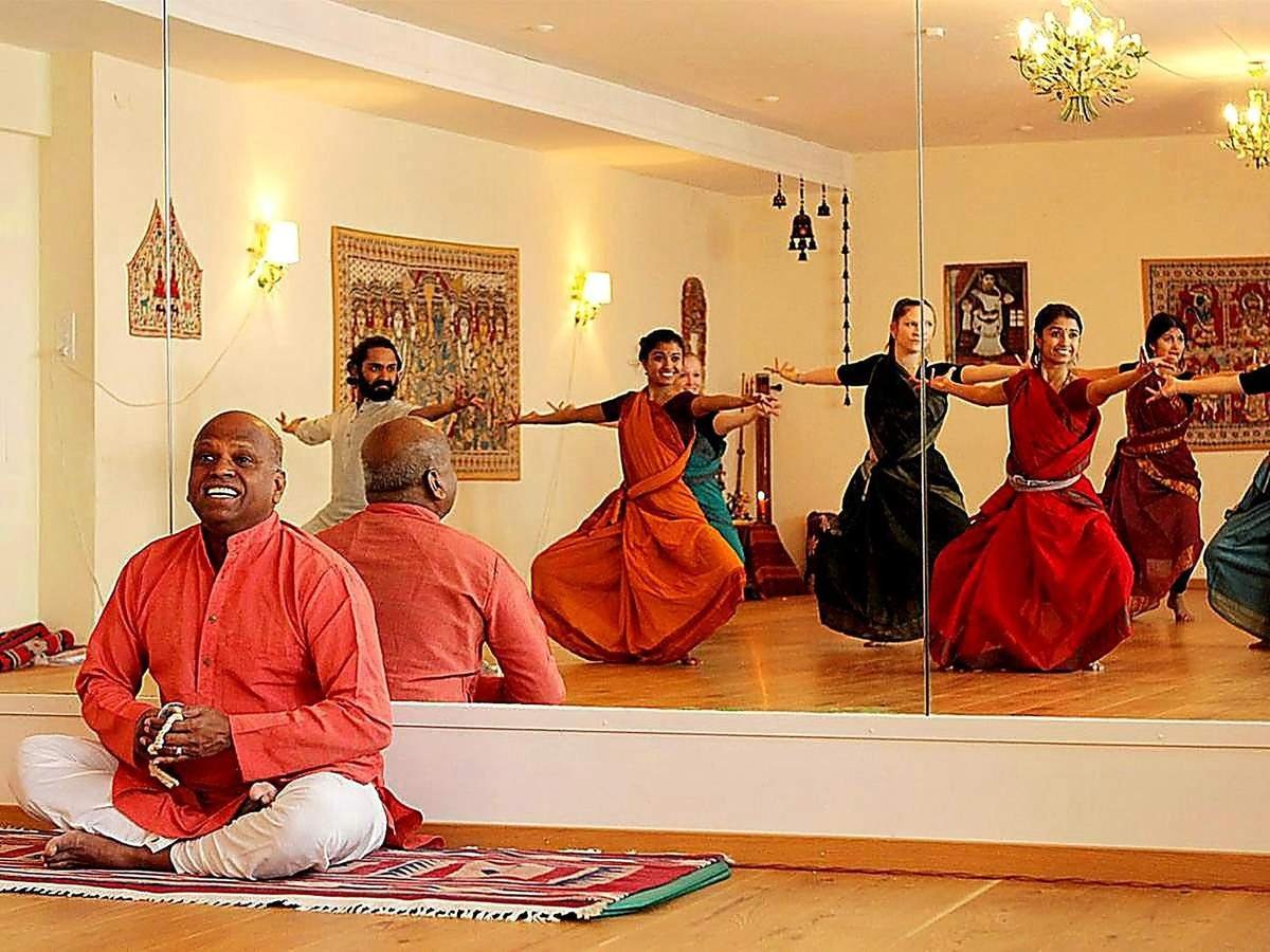 Bharatanatyam class in progress in the mirrored studio