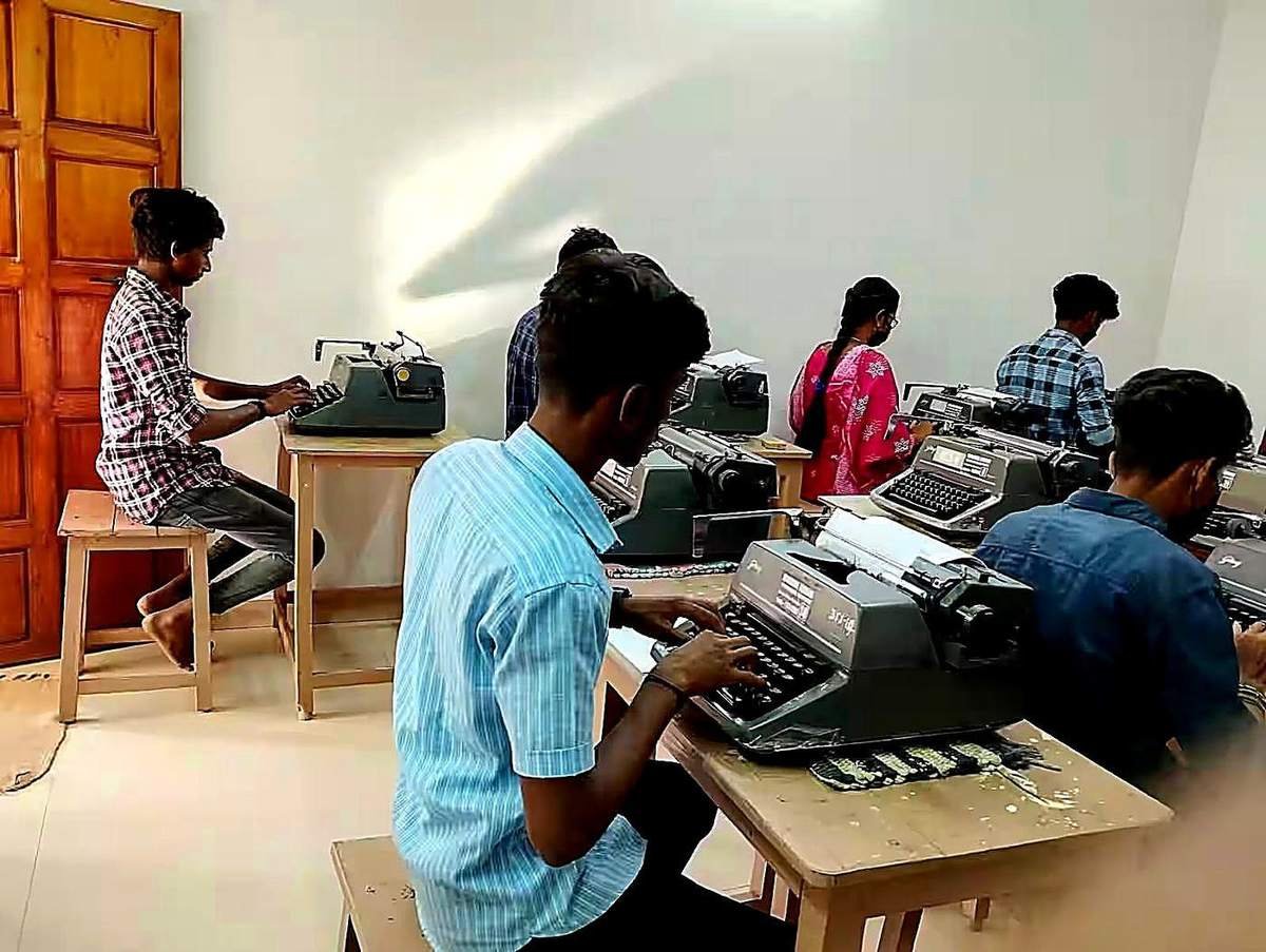 Students practising on typewriters in the institute