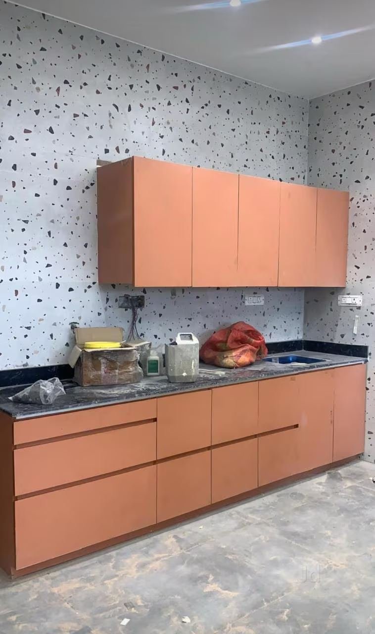 Orange modular kitchen cabinets from our workshop in Kakori, Lucknow