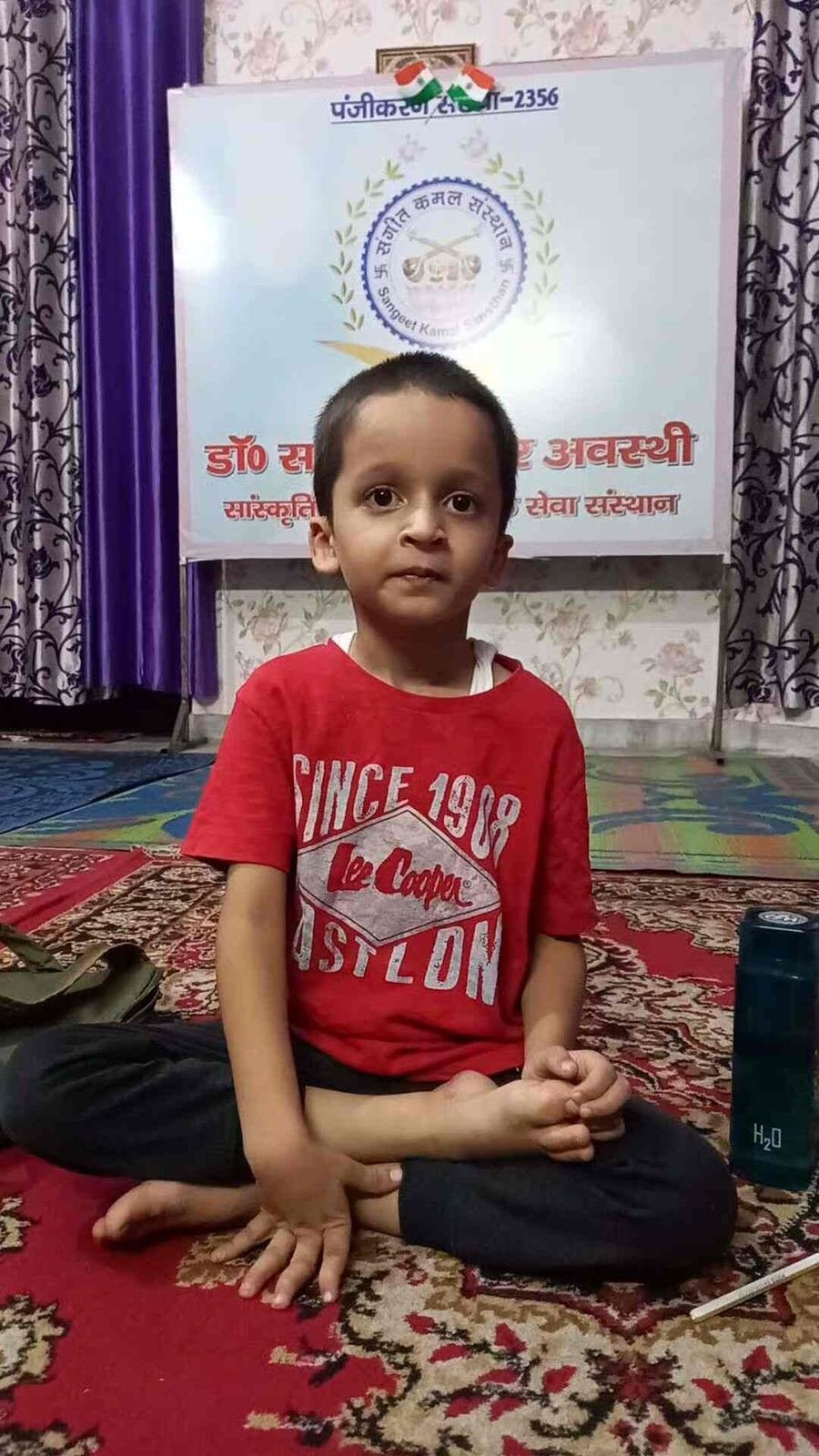 Young student attending a music class at Sangeet Kamal Sansthan