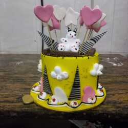 Yellow designer cake made by Shama Bakery, Aminabad