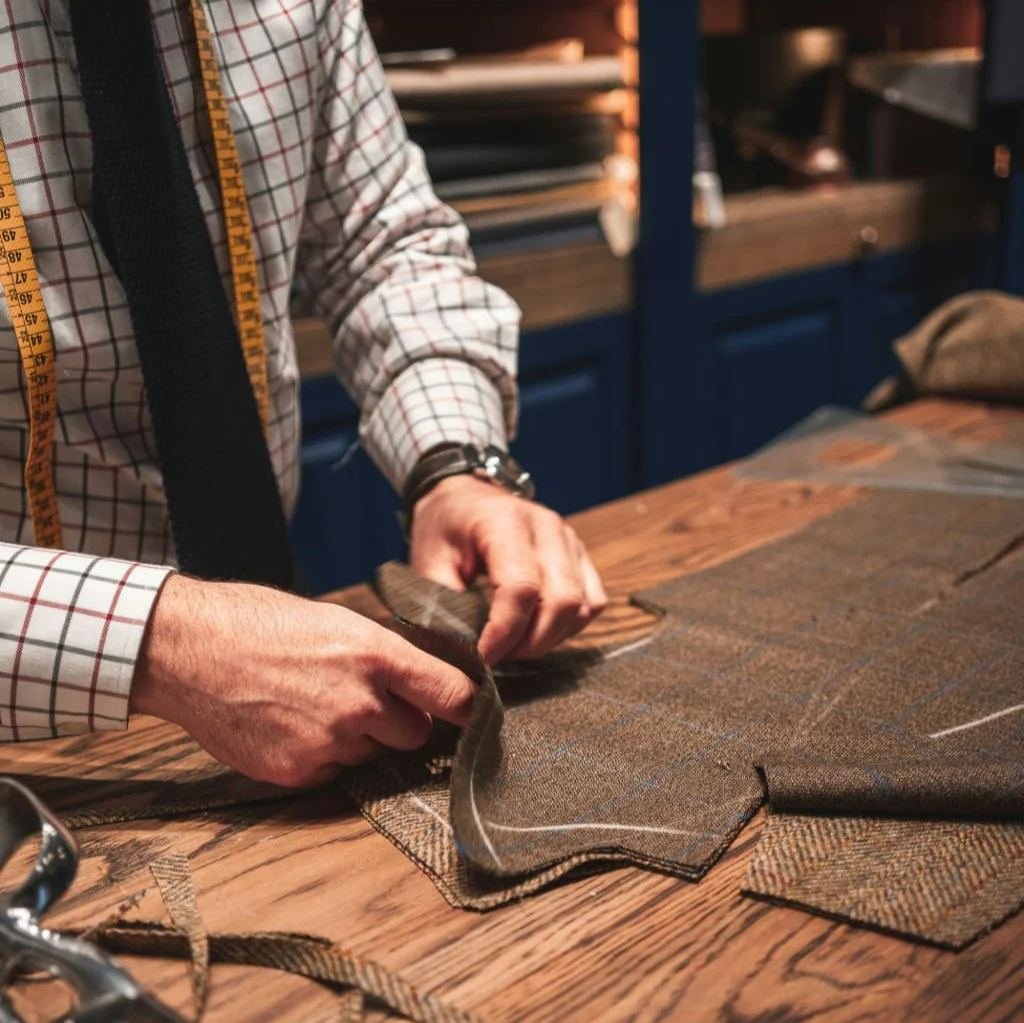 Bespoke suit pattern work on cutting table