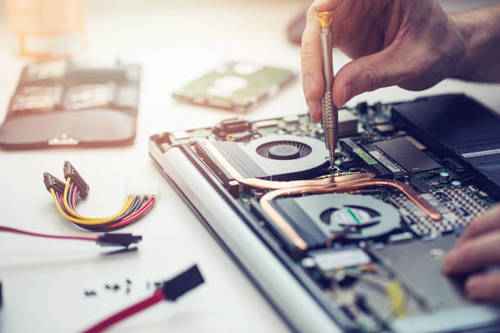 Laptop motherboard repair under magnification — water damage recovery in Indira Nagar, Lucknow