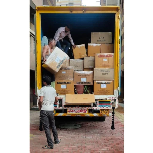 Team of movers loading boxes into a yellow truck, Verma Packers and Movers in Fazullaganj Lucknow