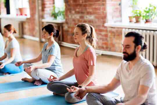 Group meditation session on mats